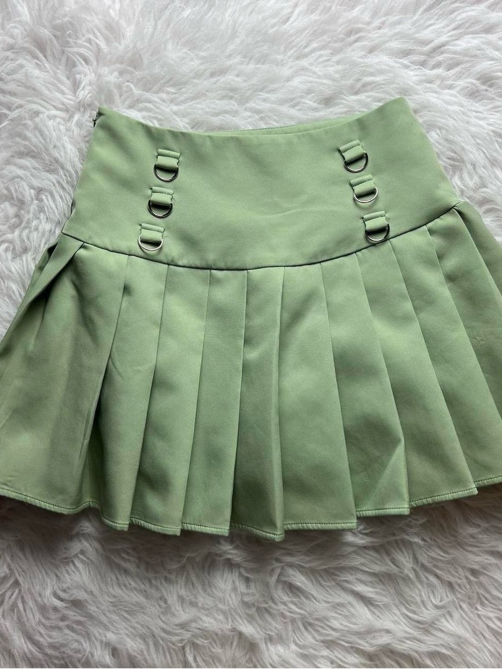 The Kript green pleated mini skirt